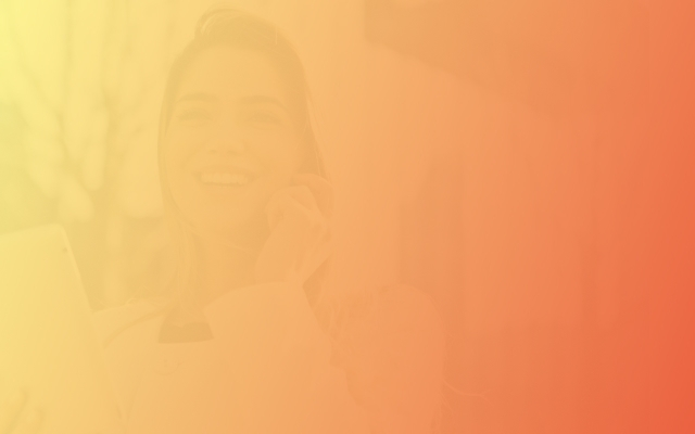 Faded orange background of a barely visible lady holding a cell phone and tablet.