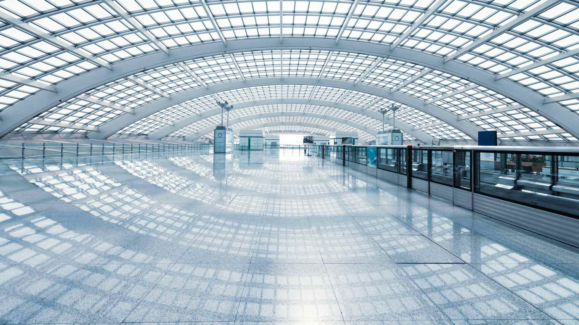 Beijing airport is empty in this photo but it's full of travelers speaking languages from around the world.